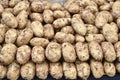 Group of brown fresh potatoes. Many fresh organic potatoes as a background. Royalty Free Stock Photo